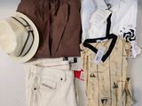 a hat, shirt, tie, shirt, and pants laid out on a table
