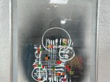 framed photograph of a picture of a man with a guitar in a room