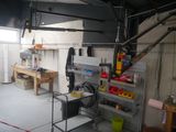 a garage with a lot of tools on the shelves