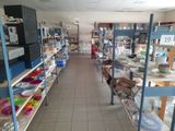 many shelves with dishes on them in a store