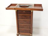 an image of a small wooden table with drawers