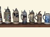many different types of beer mugs on a shelf