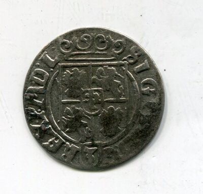 a close up of a coin on a table with a white background