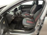 the interior of a car with the door open and the driver ' s seat up