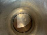 a close up of a metal object with a tag on it