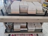 many boxes of cosmetics on a shelf in a store