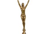 an image of a gold statue of a woman holding a sword