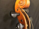 an old violin with a long neck and a wooden case