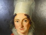 tableau représentant une femme portant une toque de chef et une robe rouge
