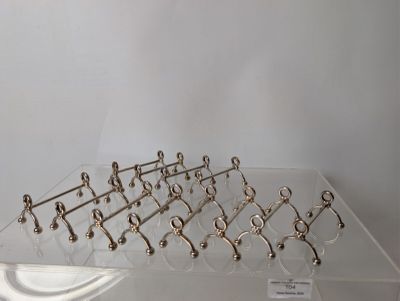 a glass display case with a bunch of hooks on it