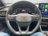 the interior of a car with a steering wheel, dashboard, and touch screen