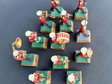 many figurines of musical instruments on a table