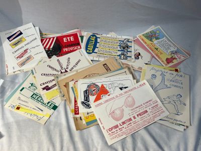 many different types of business cards laid out on a bed