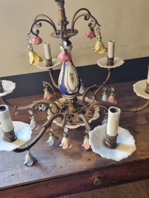 a chandelier that is sitting on a wooden table