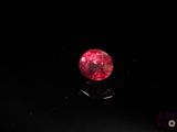 a red diamond on a black surface