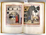 an open book with a picture of a man and a woman in a kitchen