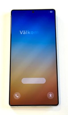 a close up of the back of a phone on a white surface