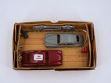 a box with a toy car and a toy car in it