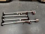 four skis sitting on the floor in a room