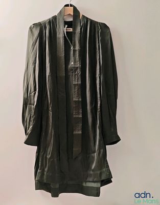 an image of a black leather jacket hanging on a hanger