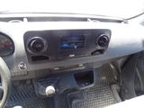 a dashboard of a car with a car radio and a steering wheel