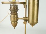 an old fashioned lamp that is on a table