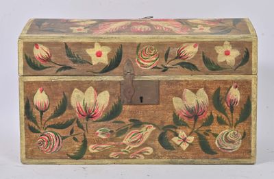 a small wooden box with a floral design on it