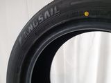 a close up of a tire on a white surface