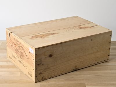 a wooden box that is sitting on a wooden floor