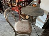 many chairs and tables in a room with a red table and chairs