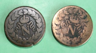 an old coin with a picture of a man and a woman on it