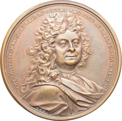 une image d'une médaille de bronze représentant un homme aux cheveux bouclés
