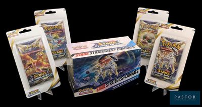 three packs of pokemon trading cards are on a black background