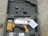 a tool in the case that is sitting on the ground