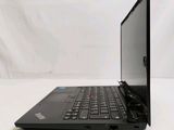 a black laptop with a black keyboard on a white surface