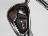 a close up view of a golf iron and a driver ' s iron