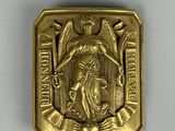 an image of a gold medal with an image of an angel on it