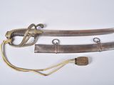 two swords that are on display on a white surface