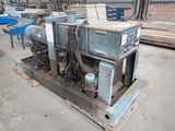 a machine that is sitting on a pallet in a warehouse