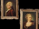 deux tableaux représentant un homme et une femme, dans un cadre doré