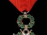 une image représentant une médaille ornée d'une étoile et d'une couronne