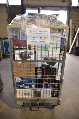 a cart with a lot of items in it in a warehouse