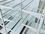 many glass shelves that are stacked on top of each other