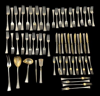 a large collection of silverware including forks and spoons