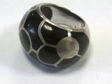a black and silver ring with a white dot on it