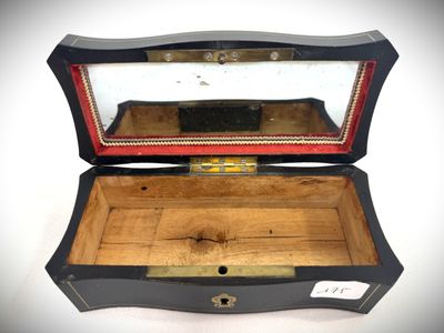 a small wooden box with a mirror inside of it