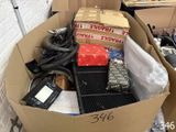 a cardboard box filled with assorted items in a room