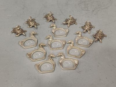 six pairs of silver plated ducks and a pair of glasses