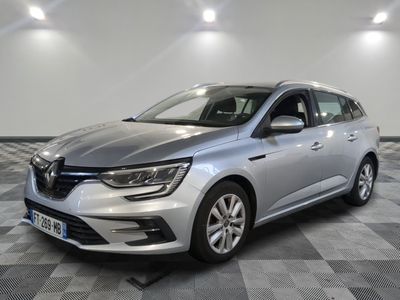 a silver car parked on a checkered floor in a garage