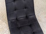 a black chair that is sitting on the floor